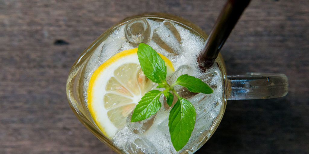 Glass of iced tea with lemon and mint