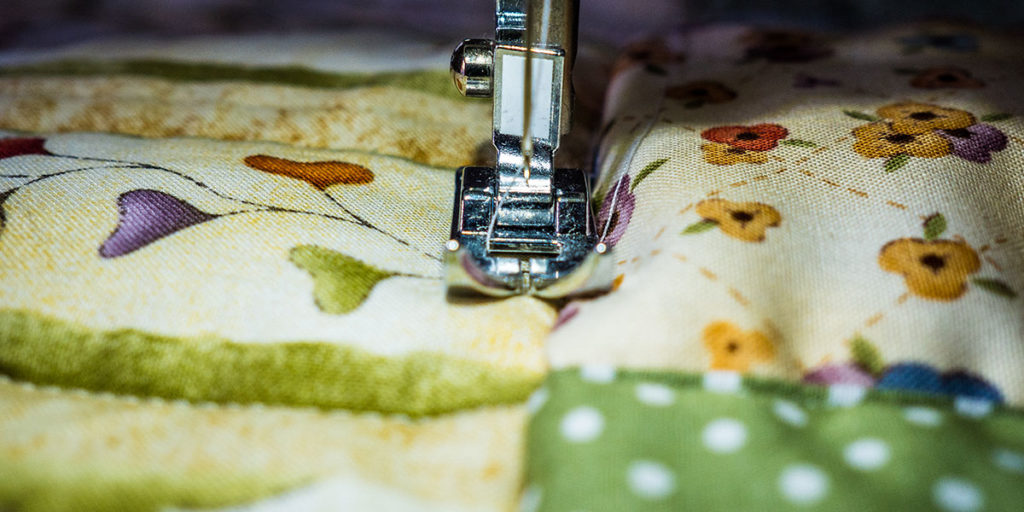 Closeup of sewing machine quilting foot