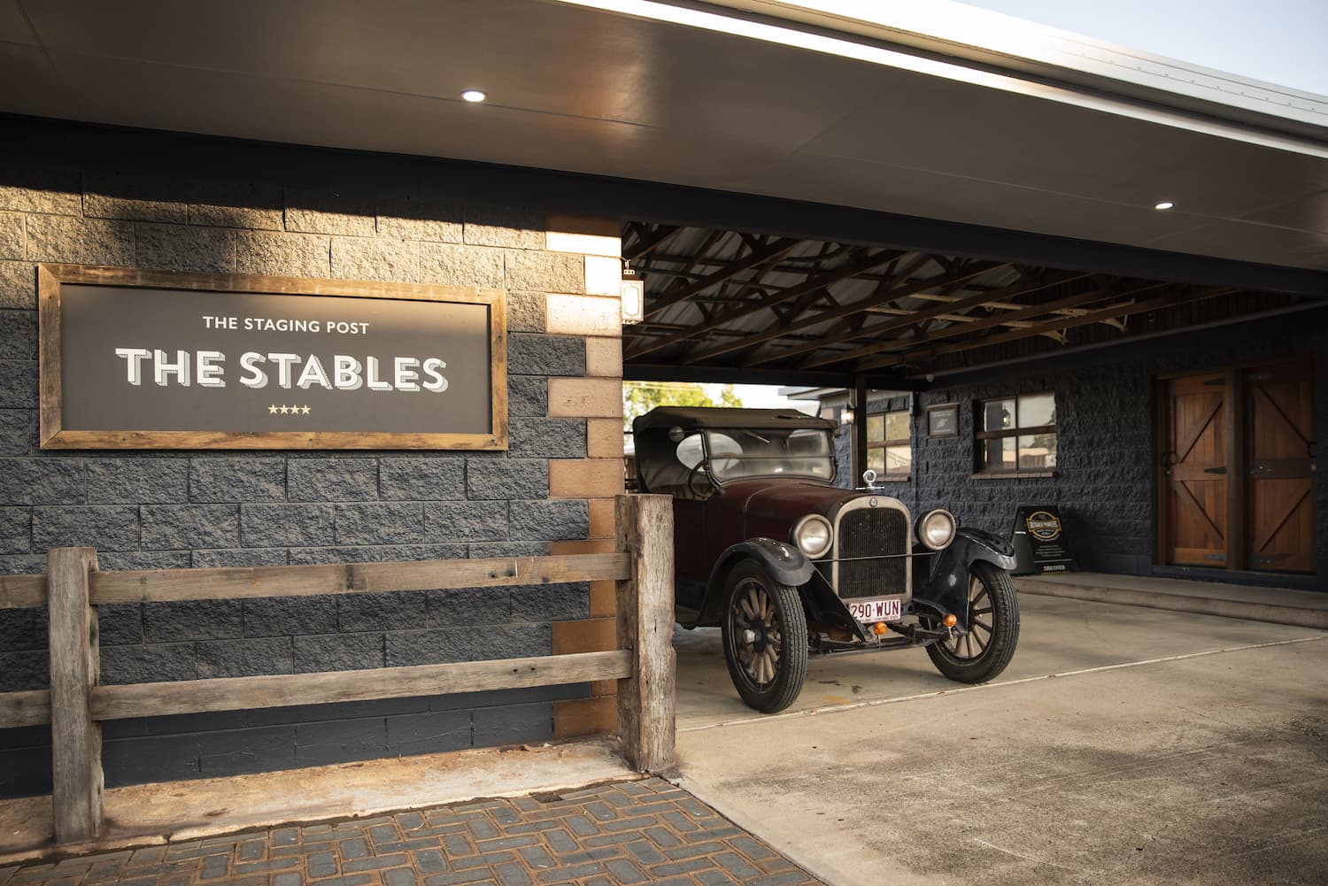 Vintage car parked in the driveway at The Stables rooms