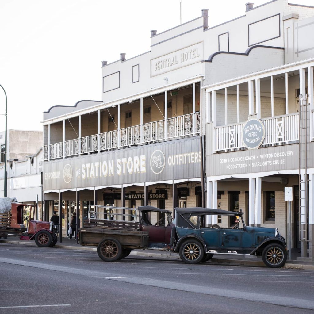 Heritage buildings in Eagle Street with vintage cars parked outside