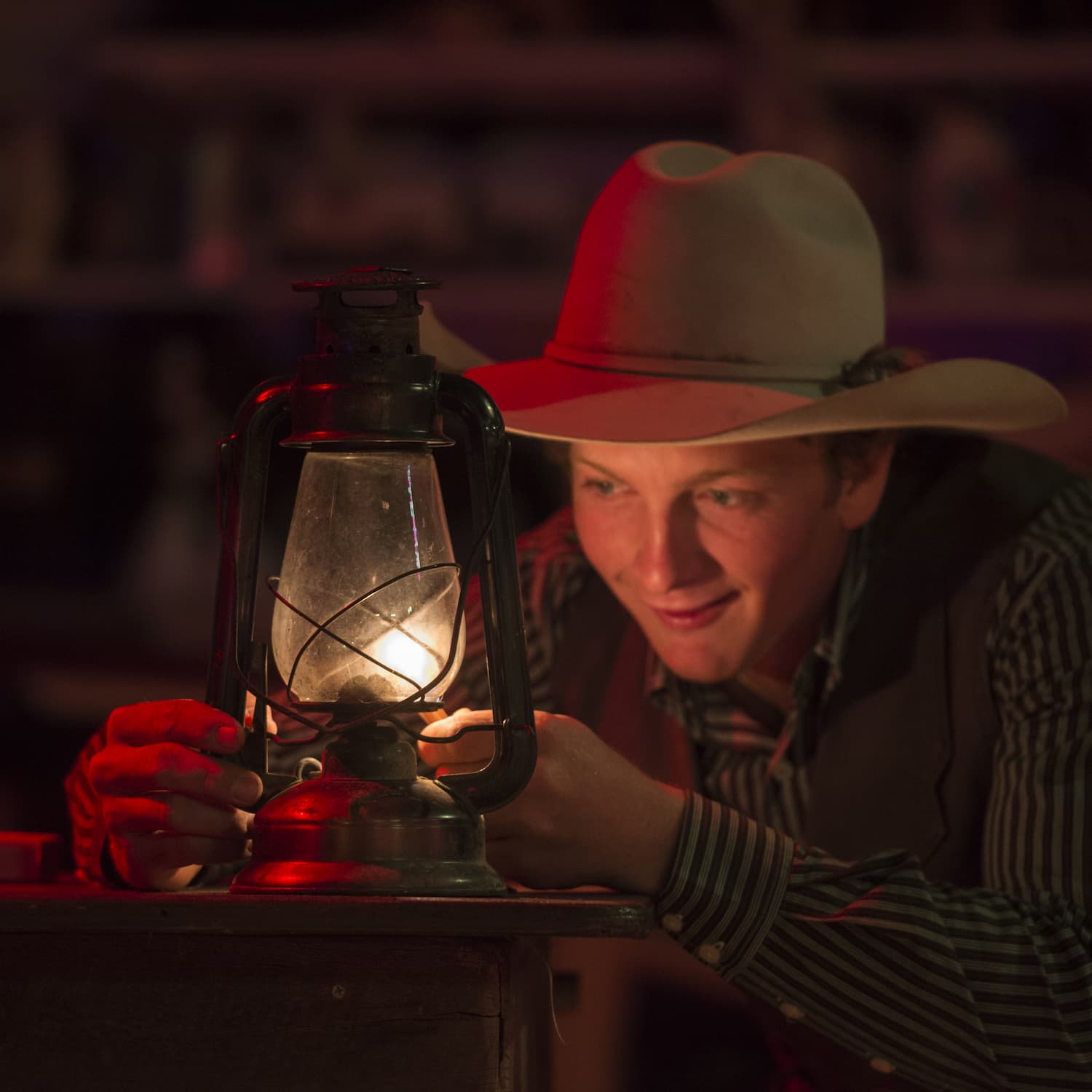 Jeremy Kinnon lighting an oil lantern