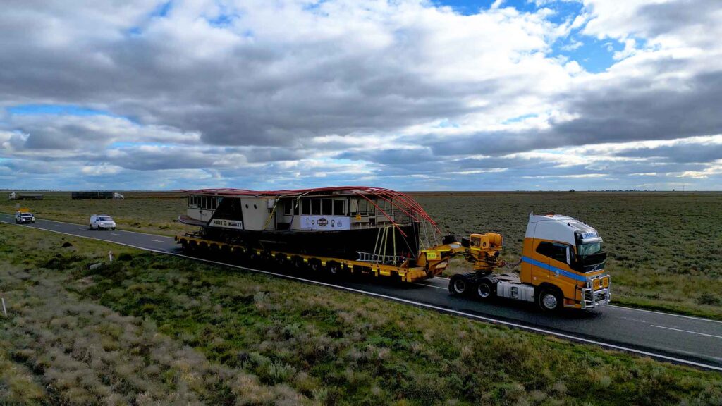 Pride of the Murray paddlewheeler being carried on the back of a truck to Longreach