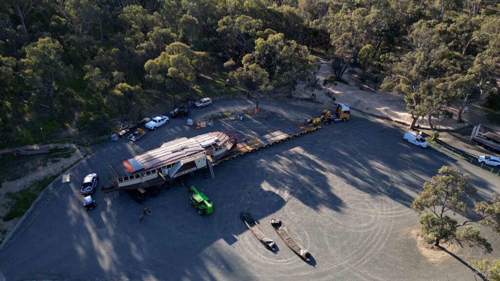 Aerial view of the Pride of the Murray on the back of a low loader departing Echuca Victoria