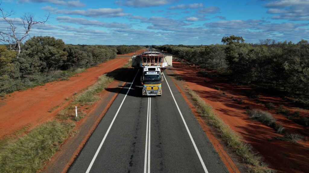 Pride of the Murray travelling on the back of a prime mover through the outback.