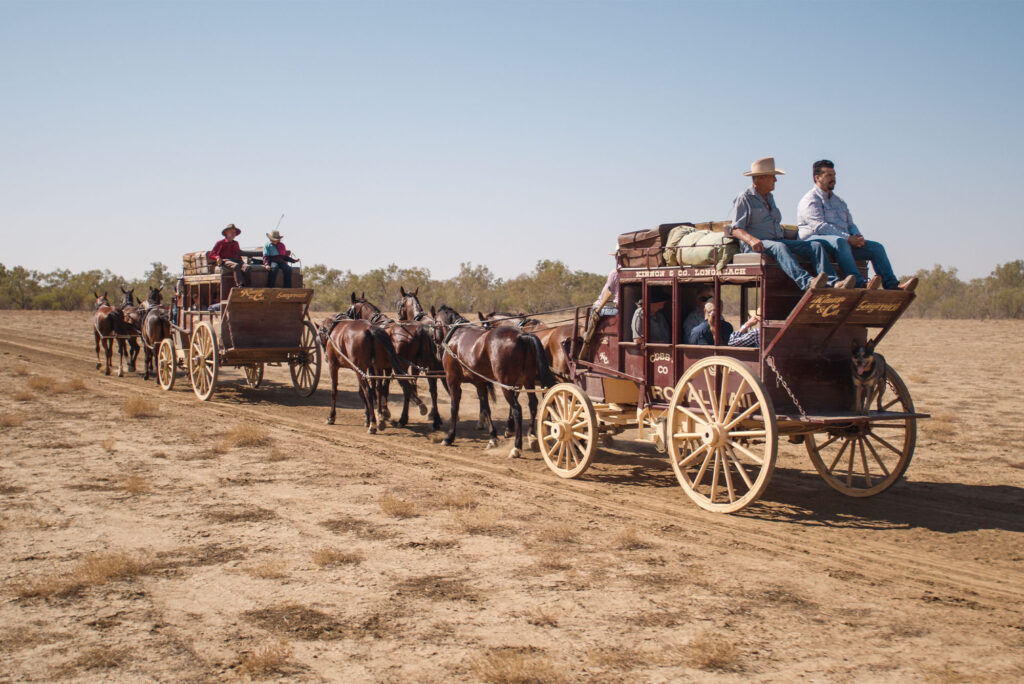 Two Cobb & Co Stagecoaches trotting down the Longreach Common