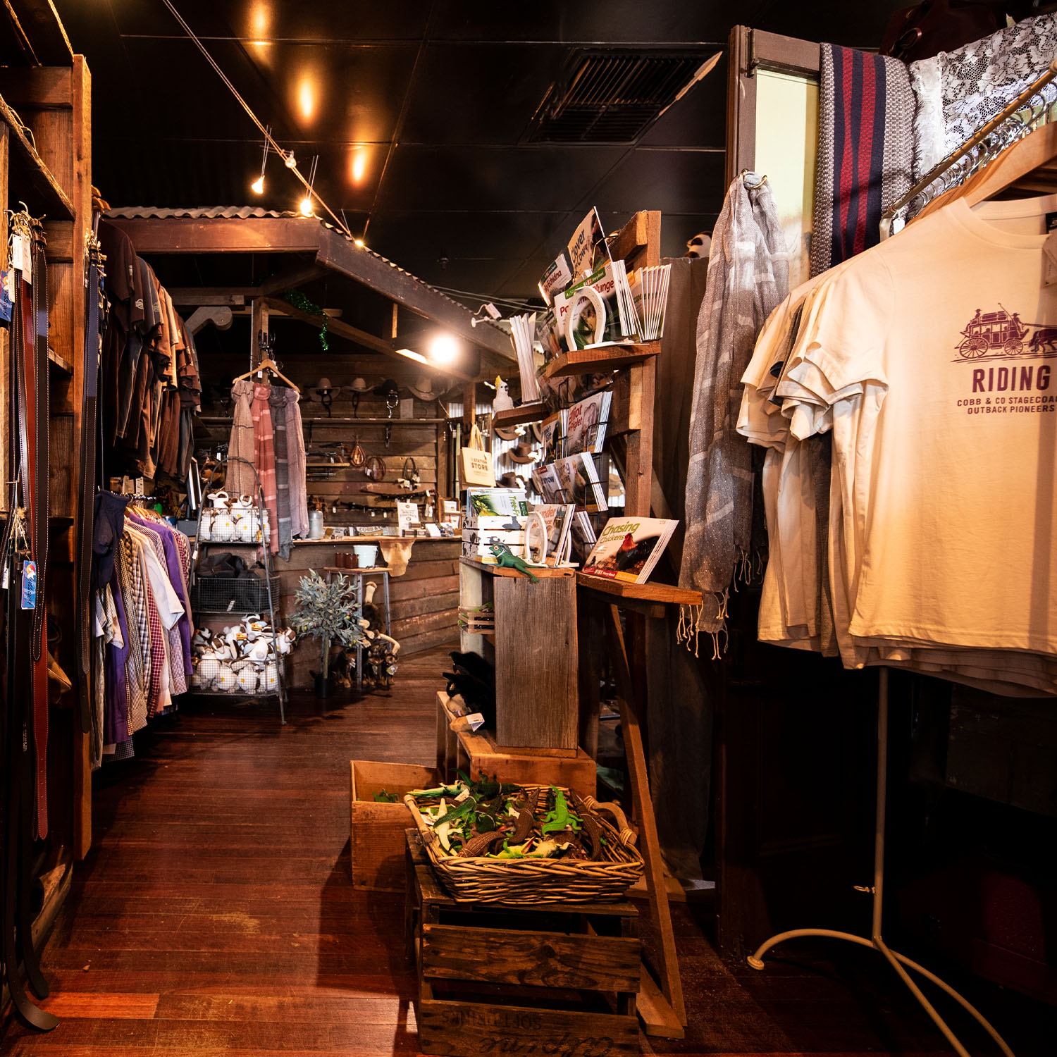 The Station Store Interior Aisle with shirts and merchandise